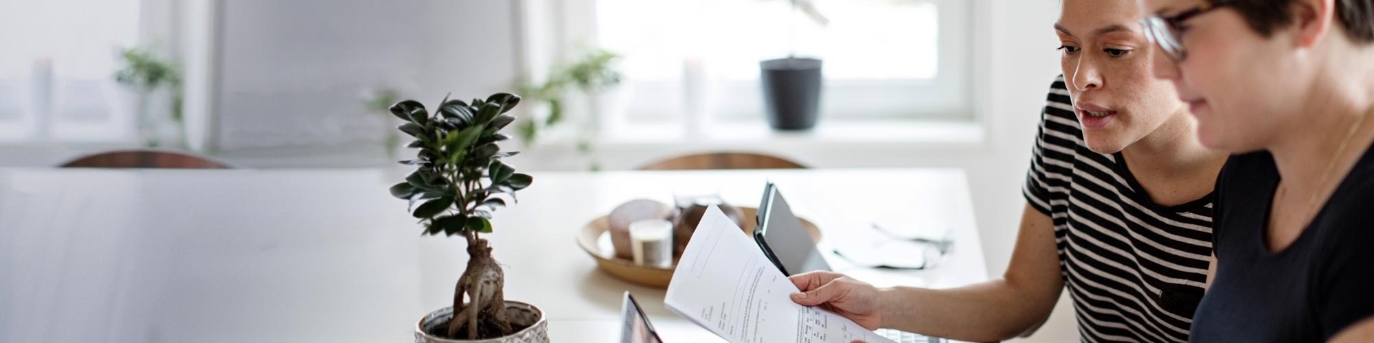 two people reading a report