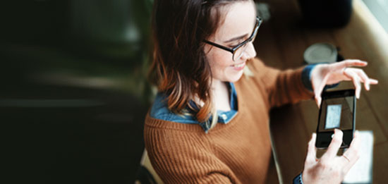 Woman taking picture on her phone