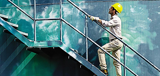 An image of a worker scaling a staircase