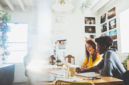 Two people working at a desk