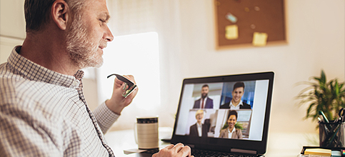 image of man collaborating via video meetings