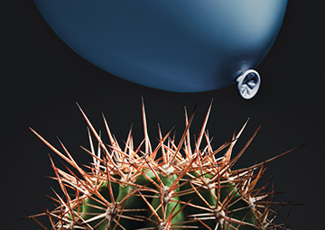 image of a balloon approaching a cactus