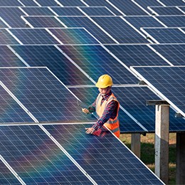 Man working with solar panel